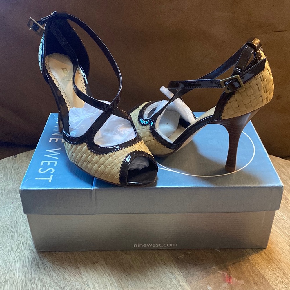 Brand new heels never worn, made in china fabric upper. Leather outsole, size 7.